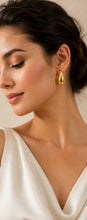 Load image into Gallery viewer, Gold teardrop stud earrings by Luxe Treasures featuring a chunky, minimalist high-polish design for statement jewelry.