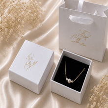 Load image into Gallery viewer, Dainty gold necklace with three freshwater pearls, minimalist layering jewelry by Luxe Treasures displayed on a white background.