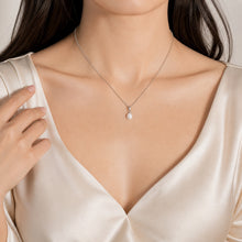 Load image into Gallery viewer, Gold teardrop pearl necklace with freshwater pearl pendant, showcasing elegant jewelry design on a white background.