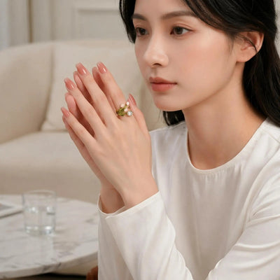 Elegant pearl flower ring with crystal accents by Luxe Treasures, featuring intricate design and shiny gold band.