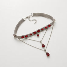 Load image into Gallery viewer, Silver choker necklace with red crystals, statement jewelry for women, featuring a sleek design and bold red accents.