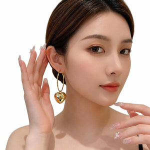 Luxury Luxe Treasures heart drop hoop earrings in a gift box, stylish fashion jewelry for women with elegant design and craftsmanship.
