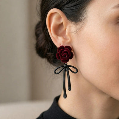 Romantic red rose earrings with black ribbon, floral dangle jewelry for women, featuring Luxe Treasures' elegant design.