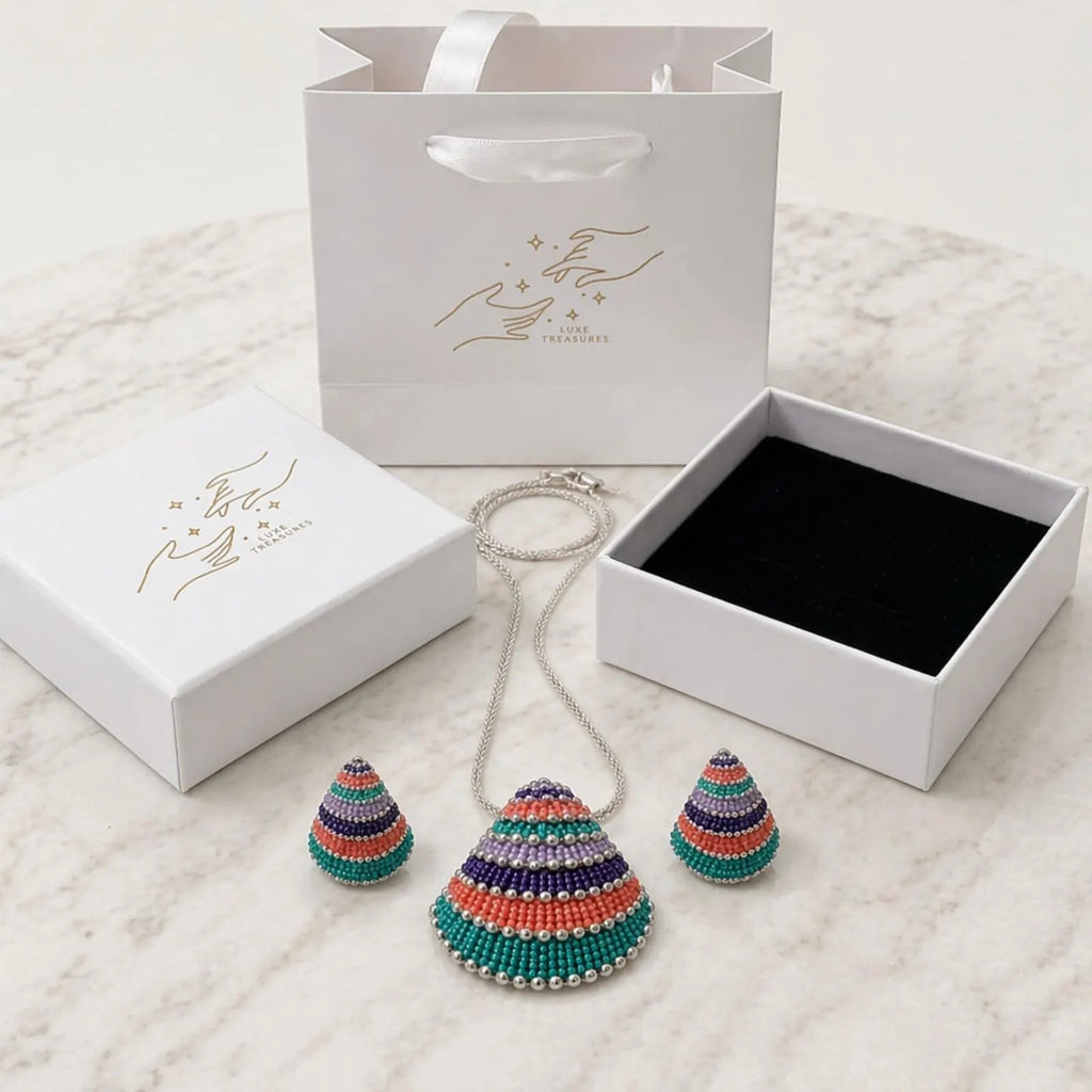 Multicolor beaded shell pendant necklace and earrings set in bohemian style jewelry by Luxe Treasures, featuring handcrafted beadwork and shells.