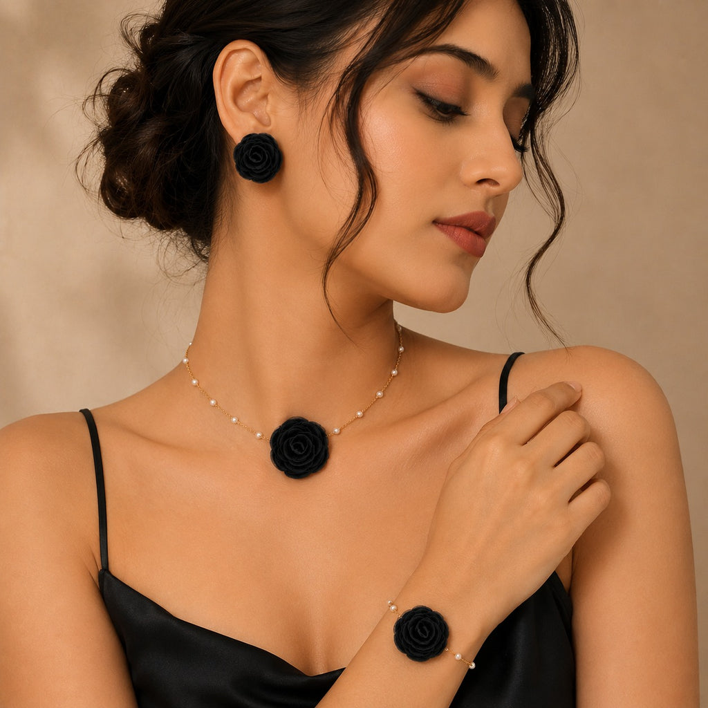 Luxe Treasures rose jewelry gift set with red, black, and white floral necklace, bracelet, and earrings in a premium box.