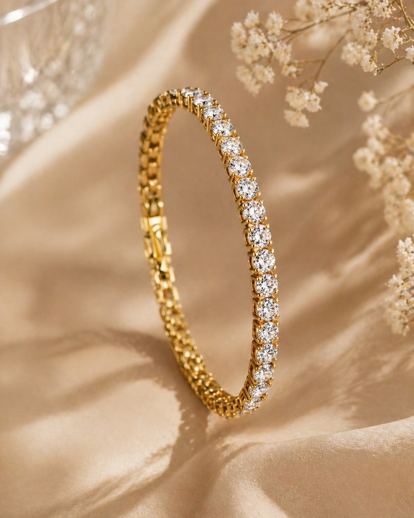 Gold tennis bracelet with sparkling zirconia stones from Luxe Treasures, showcasing a luxurious and elegant jewelry design.
