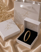 Load image into Gallery viewer, Gold tennis bracelet with sparkling zirconia stones from Luxe Treasures, showcasing a luxurious and elegant jewelry design.