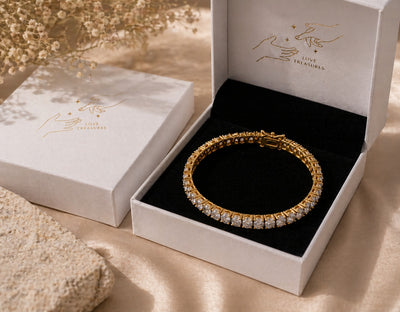 Gold tennis bracelet with sparkling zirconia stones from Luxe Treasures, featuring a luxurious and elegant jewelry design.