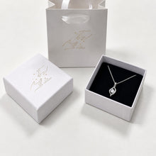 Load image into Gallery viewer, Sterling silver moissanite necklace with a dainty 0.5 carat pendant, elegant jewelry from Luxe Treasures.