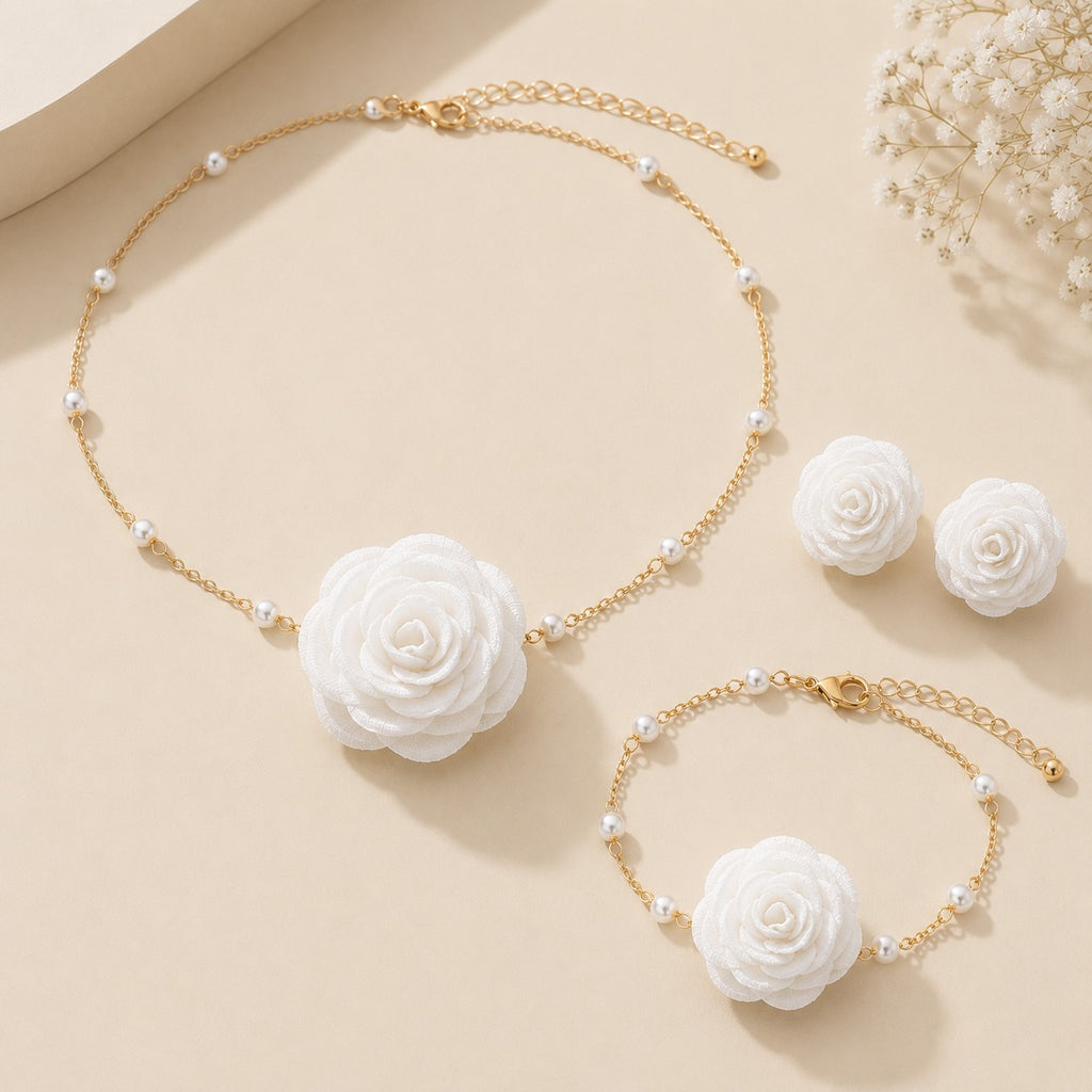 Luxe Treasures rose jewelry gift set with red, black, and white floral necklace, bracelet, and earrings in a premium box.