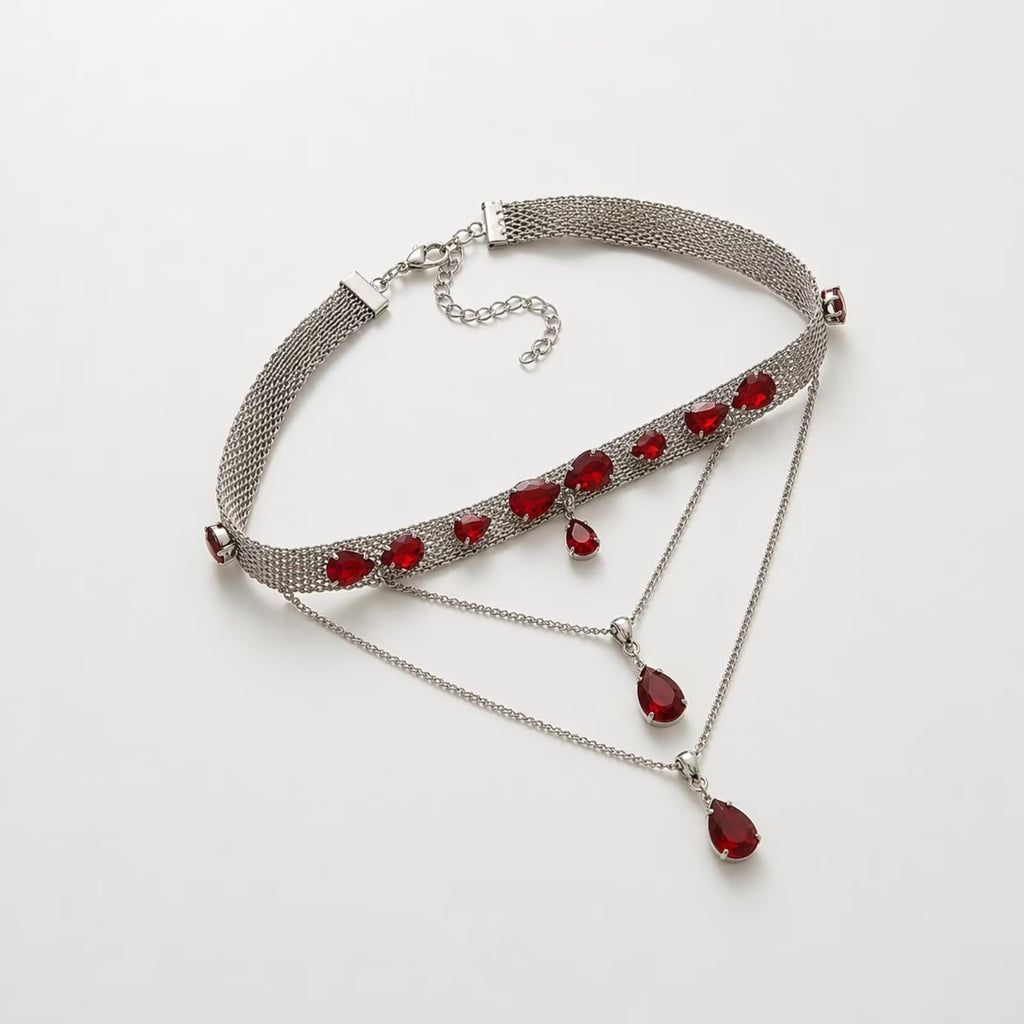 Luxury silver statement choker necklace with red stones statement jewelry for women, featuring a sleek design and bold red accents.