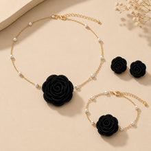 Load image into Gallery viewer, Luxe Treasures rose jewelry set with red, black, and white floral necklace, bracelet, and earrings in a premium gift box.