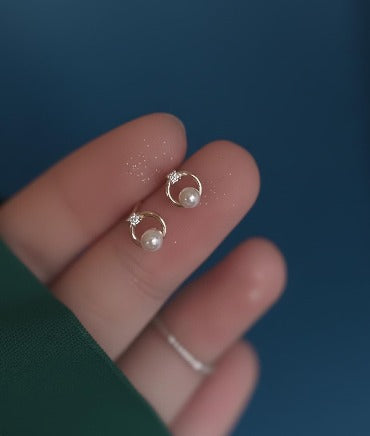 Gold circle dangle earrings with pearl and CZ accents