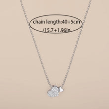 Load image into Gallery viewer, Sterling silver heart pendant necklace with zirconia stones on a delicate clavicle chain, designed by Luxe Treasures.