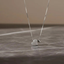 Load image into Gallery viewer, Sterling silver heart pendant necklace with zirconia on a delicate clavicle chain, designed by Luxe Treasures.