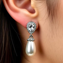 Load image into Gallery viewer, Luxe Treasures teardrop pearl dangle earrings with crystal halo design, perfect for bridal jewelry and special occasions.