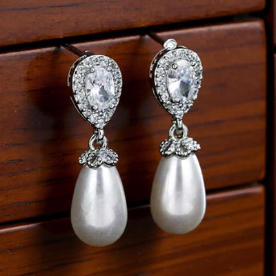 Luxe Treasures teardrop pearl dangle earrings with crystal halo design, perfect for bridal jewelry and special occasions.
