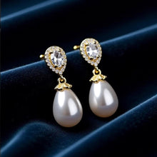 Load image into Gallery viewer, Luxe Treasures teardrop pearl dangle earrings with crystal halo, elegant bridal jewelry featuring pearl and crystal accents.