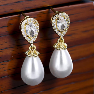 Luxe Treasures teardrop pearl dangle earrings with crystal halo for bridal jewelry, featuring elegant pearl drops and sparkling accents.