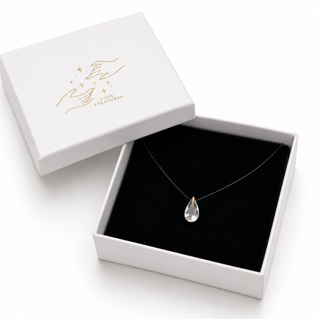 Handmade teardrop pendant from Luxe Treasures, elegant jewelry gift for her, featuring a delicate chain.